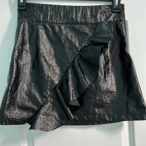 DO + BE mini skirt with asymmetrical ruffle detail. Black. Size M